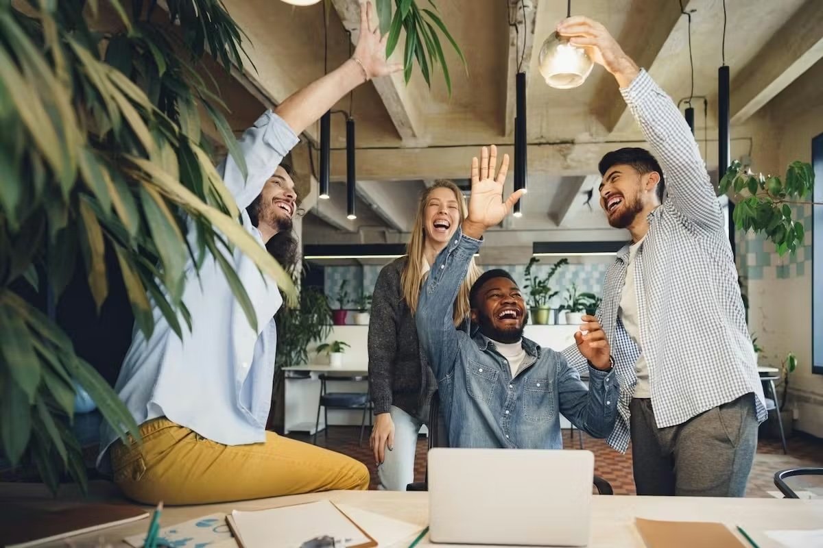 Employees celebrating in a workplace